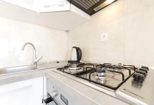 Kuchyň nebo kuchyňský kout v ubytování Apartments New home