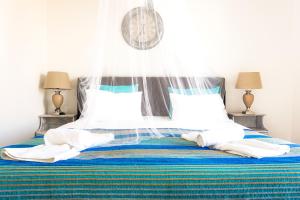 Letto o letti in una camera di Cubaneros Holiday Inn