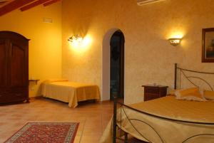 Postel nebo postele na pokoji v ubytování B&B Triskèles