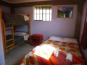 Poschodová posteľ alebo postele v izbe v ubytovaní Humberto Guest House