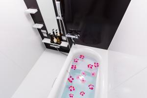 a sewing machine with pink flowers on the door at Condominium Hotel Monpa in Chatan