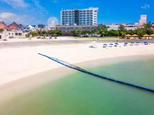 a large blue net in the water near a beach at Condominium Hotel Monpa in Chatan