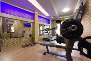 a room with a gym with a treadmill and weights at Hotel Verona in Byala Ruse