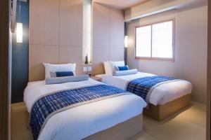 Postel nebo postele na pokoji v ubytování Hotel Ofutei