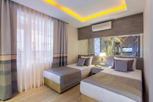 Postel nebo postele na pokoji v ubytování Hotel Turan Prince - Ex Sentido Turan Prince