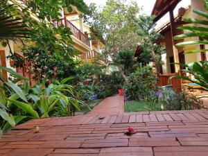 a brick walkway in front of a building at Free Beach Resort in Phú Quốc