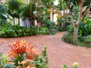 a brick walkway in front of a building at Free Beach Resort in Phú Quốc