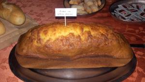 a loaf of bread on a plate on a table at Castellu Rossu in Lucciana