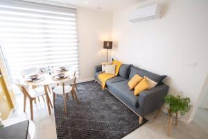 a living room with a couch and a table at Studio Brussels Airport - South in Zaventem