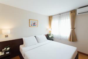 Ένα ή περισσότερα κρεβάτια σε δωμάτιο στο Seasons Siam Hotel +68 φωτογραφίες