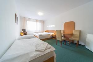 Posteľ alebo postele v izbe v ubytovaní Hotel Arnost Garni