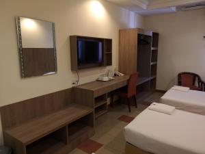 Postel nebo postele na pokoji v ubytování HOTEL AMBASSADOR 1