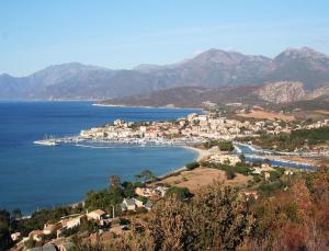 a small town on the shore of a body of water at Résidence Suarella in Saint-Florent