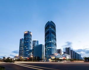 a city skyline with tall buildings and a street at Tianyuan Grand Hotel Xiamen-Free Welcome Fruit in Xiamen