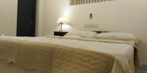 Postel nebo postele na pokoji v ubytování Padamadan homestay