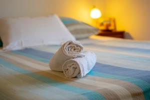 a towel sitting on top of a bed at Apartment IRENA with Bikes included in Pula