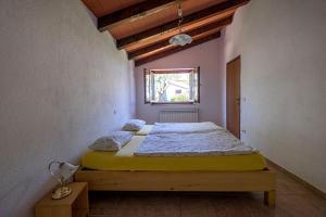 Posteľ alebo postele v izbe v ubytovaní Villa Ana