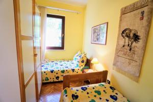 En eller flere senge i et værelse på Villa Viktoria Monterosso