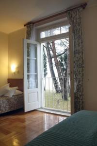 En eller flere senge i et værelse på Apartment Teresa