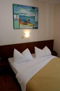 En eller flere senge i et værelse på Apartment Teresa