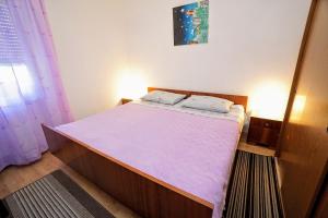 Posteľ alebo postele v izbe v ubytovaní Apartment Cirila