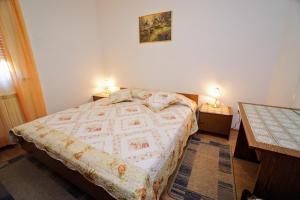 Posteľ alebo postele v izbe v ubytovaní Apartment Cirila