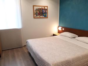 Postel nebo postele na pokoji v ubytování Hotel San Giorgio
