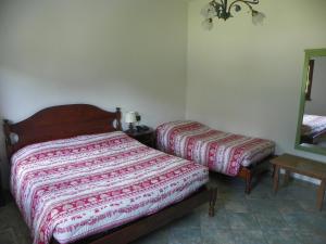Postel nebo postele na pokoji v ubytování Hotel Les Granges