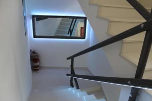 a mirror on the wall next to a staircase at Villa Marina in Omiš