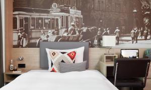 Cama ou camas em um quarto em Living Hotel Frankfurt