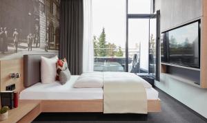 Cama ou camas em um quarto em Living Hotel Frankfurt