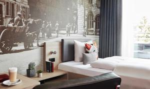 Cama ou camas em um quarto em Living Hotel Frankfurt mais 37 fotos
