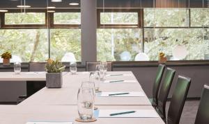 Um restaurante ou outro lugar para comer em Living Hotel Frankfurt