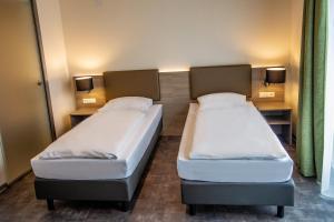 Postel nebo postele na pokoji v ubytování Hotel Holzscheiter