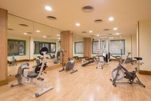 a gym with several treadmills and exercise bikes at htop Royal Star SPA - Fun in Lloret de Mar