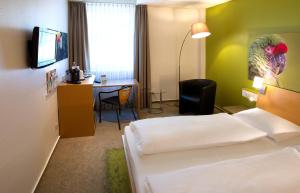 TV a/nebo společenská místnost v ubytování Anders Hotel Walsrode