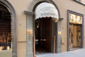 a store front with a room maker sign over the door at Room Mate Collection Isabella, Florence in Florence +33 photos