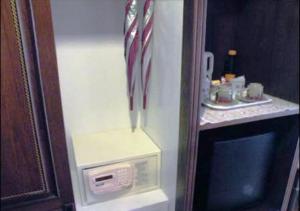 a refrigerator with an american flag on the side of it at P.P. Palmtree Resort in Phi Phi Don