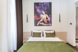 Postel nebo postele na pokoji v ubytování Hotel Grand Hedonist