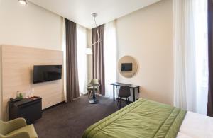 TV a/nebo společenská místnost v ubytování Hotel Grand Hedonist