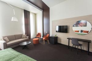 TV a/nebo společenská místnost v ubytování Hotel Grand Hedonist