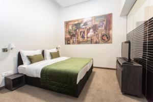 Postel nebo postele na pokoji v ubytování Hotel Grand Hedonist