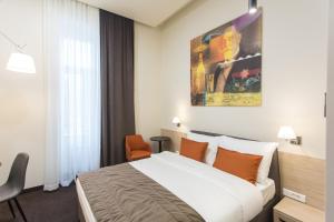 Postel nebo postele na pokoji v ubytování Hotel Grand Hedonist