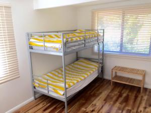 A bunk bed or bunk beds in a room at The Kite Beach House