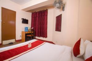Rúm í herbergi á Hotel Premium