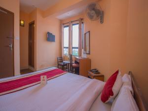 Rúm í herbergi á Hotel Premium