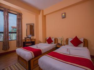Rúm í herbergi á Hotel Premium