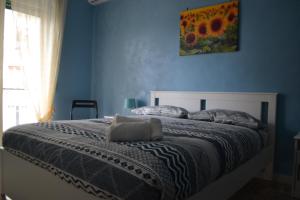 Postel nebo postele na pokoji v ubytování Domus Oltremare Flegrea