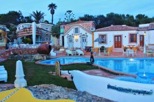 a house with a boat in the yard at Villa Ana Margarida Beach in Ericeira +25 photos