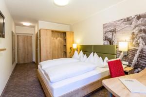 Un ou plusieurs lits dans un hébergement de l'établissement Hotel & Restaurant Urdlwirt